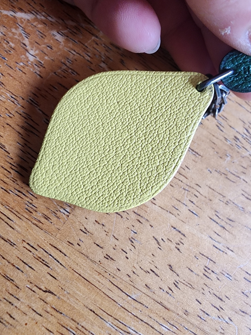 Hermès leather lemon bag charm featuring a green leaf. - Picture 3 of 10